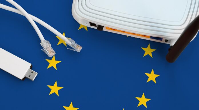 European union flag depicted on table with internet rj45 cable
