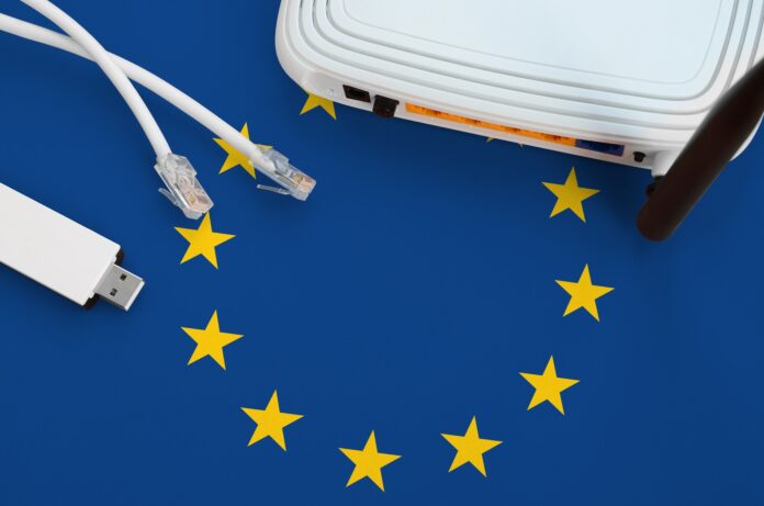 European union flag depicted on table with internet rj45 cable