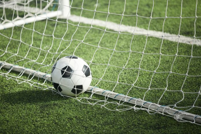 Soccer ball in gate